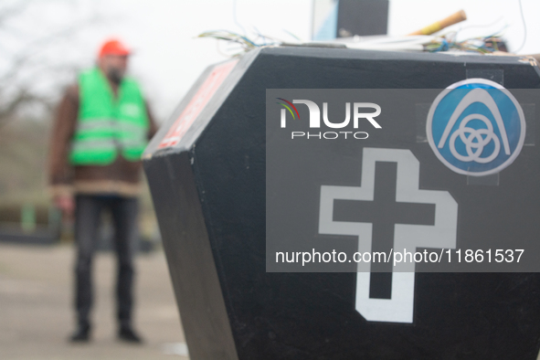 A coffin with the IGM logo is seen as a hundred Thyssenkrupp Europe Steel workers march against planned job cuts before heading to the Works...