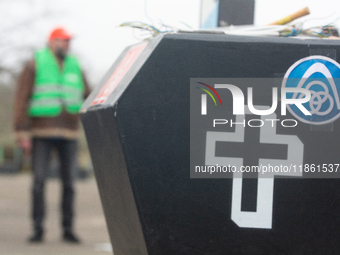 A coffin with the IGM logo is seen as a hundred Thyssenkrupp Europe Steel workers march against planned job cuts before heading to the Works...