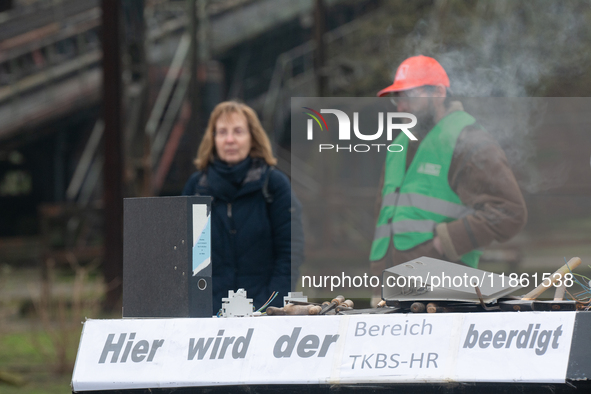 A coffin with ''Here is the mourning for TKBS HR'' is seen as a hundred Thyssenkrupp Europe Steel workers march against planned job cuts bef...