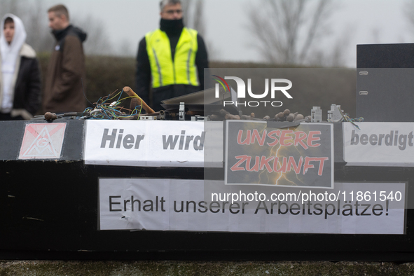 A coffin with the message ''here is the mourning for our future'' is seen as a hundred Thyssenkrupp Europe Steel workers march against plann...