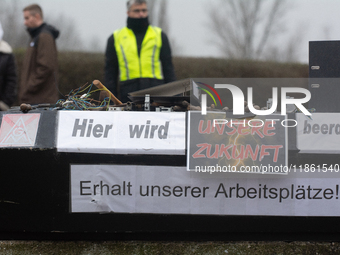 A coffin with the message ''here is the mourning for our future'' is seen as a hundred Thyssenkrupp Europe Steel workers march against plann...