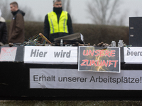 A coffin with the message ''here is the mourning for our future'' is seen as a hundred Thyssenkrupp Europe Steel workers march against plann...