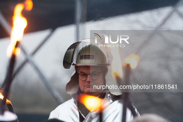 One hundred Thyssenkrupp Europe Steel workers march against planned job cuts before heading to the Works Council meeting in Duisburg, German...