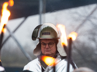 One hundred Thyssenkrupp Europe Steel workers march against planned job cuts before heading to the Works Council meeting in Duisburg, German...