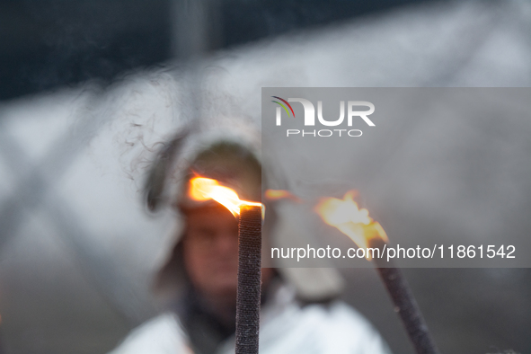 One hundred Thyssenkrupp Europe Steel workers march against planned job cuts before heading to the Works Council meeting in Duisburg, German...