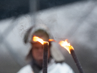 One hundred Thyssenkrupp Europe Steel workers march against planned job cuts before heading to the Works Council meeting in Duisburg, German...