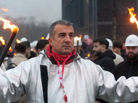 One hundred Thyssenkrupp Europe Steel workers march against planned job cuts before heading to the Works Council meeting in Duisburg, German...