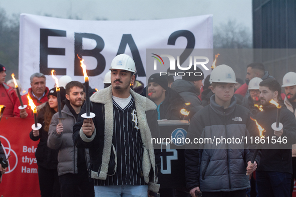 One hundred Thyssenkrupp Europe Steel workers march against planned job cuts before heading to the Works Council meeting in Duisburg, German...