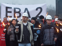 One hundred Thyssenkrupp Europe Steel workers march against planned job cuts before heading to the Works Council meeting in Duisburg, German...