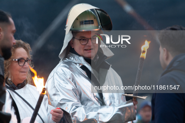 One hundred Thyssenkrupp Europe Steel workers march against planned job cuts before heading to the Works Council meeting in Duisburg, German...