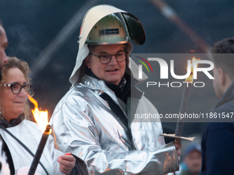 One hundred Thyssenkrupp Europe Steel workers march against planned job cuts before heading to the Works Council meeting in Duisburg, German...