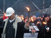 A hundred Thyssenkrupp Europe Steel workers march with a coffin against planned job cuts before heading to the Works Council meeting in Duis...