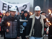 A hundred Thyssenkrupp Europe Steel workers march with a coffin against planned job cuts before heading to the Works Council meeting in Duis...