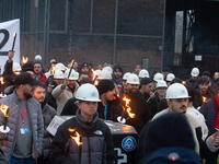 A hundred Thyssenkrupp Europe Steel workers march with a coffin against planned job cuts before heading to the Works Council meeting in Duis...