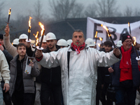 A hundred Thyssenkrupp Europe Steel workers march with a coffin against planned job cuts before heading to the Works Council meeting in Duis...