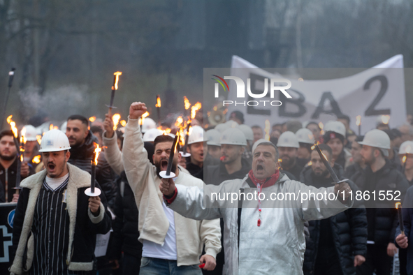 A hundred Thyssenkrupp Europe Steel workers march with a coffin against planned job cuts before heading to the Works Council meeting in Duis...