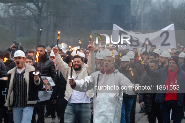 A hundred Thyssenkrupp Europe Steel workers march with a coffin against planned job cuts before heading to the Works Council meeting in Duis...