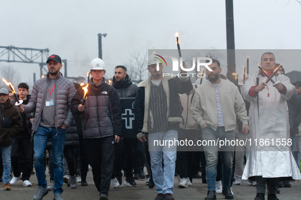 A hundred Thyssenkrupp Europe Steel workers march with a coffin against planned job cuts before heading to the Works Council meeting in Duis...