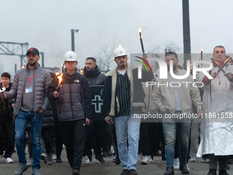 A hundred Thyssenkrupp Europe Steel workers march with a coffin against planned job cuts before heading to the Works Council meeting in Duis...