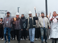 A hundred Thyssenkrupp Europe Steel workers march with a coffin against planned job cuts before heading to the Works Council meeting in Duis...