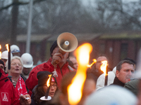 A hundred Thyssenkrupp Europe Steel workers march with a coffin against planned job cuts before heading to the Works Council meeting in Duis...