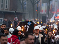 A hundred Thyssenkrupp Europe Steel workers march with a coffin against planned job cuts before heading to the Works Council meeting in Duis...