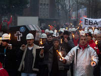 A hundred Thyssenkrupp Europe Steel workers march with a coffin against planned job cuts before heading to the Works Council meeting in Duis...