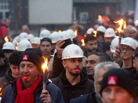 A hundred Thyssenkrupp Europe Steel workers march with a coffin against planned job cuts before heading to the Works Council meeting in Duis...