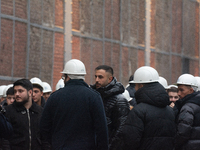 A hundred Thyssenkrupp Europe Steel workers march with a coffin against planned job cuts before heading to the Works Council meeting in Duis...