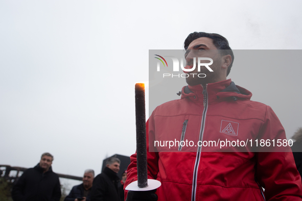 A hundred Thyssenkrupp Europe Steel workers march with a coffin against planned job cuts before heading to the Works Council meeting in Duis...