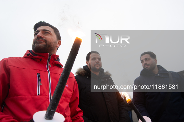 A hundred Thyssenkrupp Europe Steel workers march with a coffin against planned job cuts before heading to the Works Council meeting in Duis...