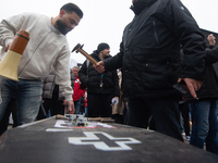 A hundred Thyssenkrupp Europe Steel workers march with a coffin against planned job cuts before heading to the Works Council meeting in Duis...