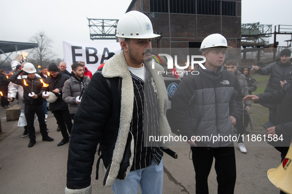 A hundred Thyssenkrupp Europe Steel workers march with a coffin against planned job cuts before heading to the Works Council meeting in Duis...