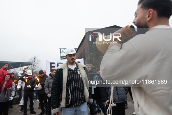 A hundred Thyssenkrupp Europe Steel workers march with a coffin against planned job cuts before heading to the Works Council meeting in Duis...