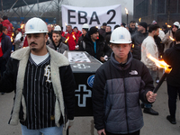 A hundred Thyssenkrupp Europe Steel workers march with a coffin against planned job cuts before heading to the Works Council meeting in Duis...