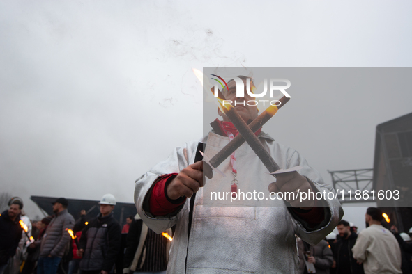 A hundred Thyssenkrupp Europe Steel workers march with a coffin against planned job cuts before heading to the Works Council meeting in Duis...