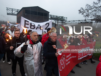 A hundred Thyssenkrupp Europe Steel workers march with a coffin against planned job cuts before heading to the Works Council meeting in Duis...