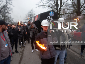 A hundred Thyssenkrupp Europe Steel workers march with a coffin against planned job cuts before heading to the Works Council meeting in Duis...