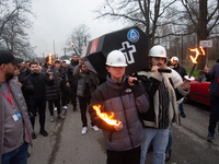 A hundred Thyssenkrupp Europe Steel workers march with a coffin against planned job cuts before heading to the Works Council meeting in Duis...