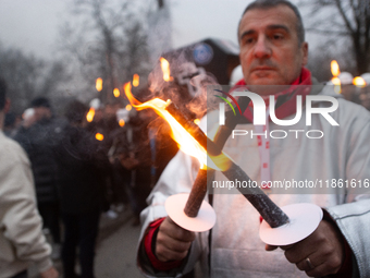 A hundred Thyssenkrupp Europe Steel workers march with a coffin against planned job cuts before heading to the Works Council meeting in Duis...