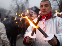 A hundred Thyssenkrupp Europe Steel workers march with a coffin against planned job cuts before heading to the Works Council meeting in Duis...