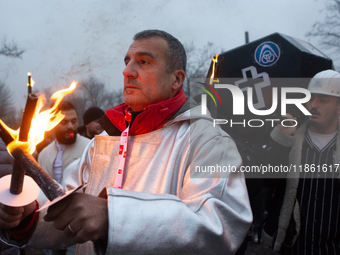 A hundred Thyssenkrupp Europe Steel workers march with a coffin against planned job cuts before heading to the Works Council meeting in Duis...