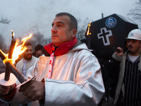 A hundred Thyssenkrupp Europe Steel workers march with a coffin against planned job cuts before heading to the Works Council meeting in Duis...