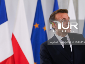 In Warsaw, Poland, on December 12, 2024, French President Emmanuel Macron meets with Polish Prime Minister Donald Tusk at the Chancellery of...