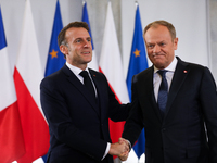 In Warsaw, Poland, on December 12, 2024, French President Emmanuel Macron meets with Polish Prime Minister Donald Tusk at the Chancellery of...