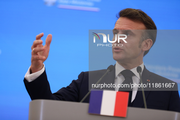 In Warsaw, Poland, on December 12, 2024, French President Emmanuel Macron meets with Polish Prime Minister Donald Tusk at the Chancellery of...