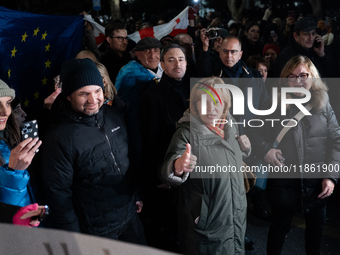 Several MEPs are present during a demonstration against the Georgian government's postponement of European Union accession talks until 2028,...