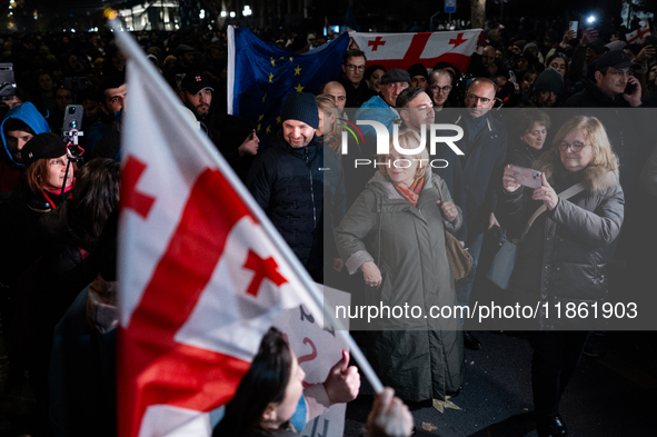 Several MEPs are present during a demonstration against the Georgian government's postponement of European Union accession talks until 2028,...