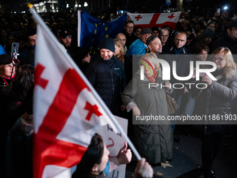 Several MEPs are present during a demonstration against the Georgian government's postponement of European Union accession talks until 2028,...