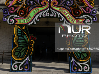 A floral cover is outside a church in Santa Maria Tomatlan in the Iztapalapa borough, Mexico City, on December 12, 2024, for the celebration...